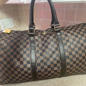 Louie Vuitton duffel bag brand new tags still in it. Never used
